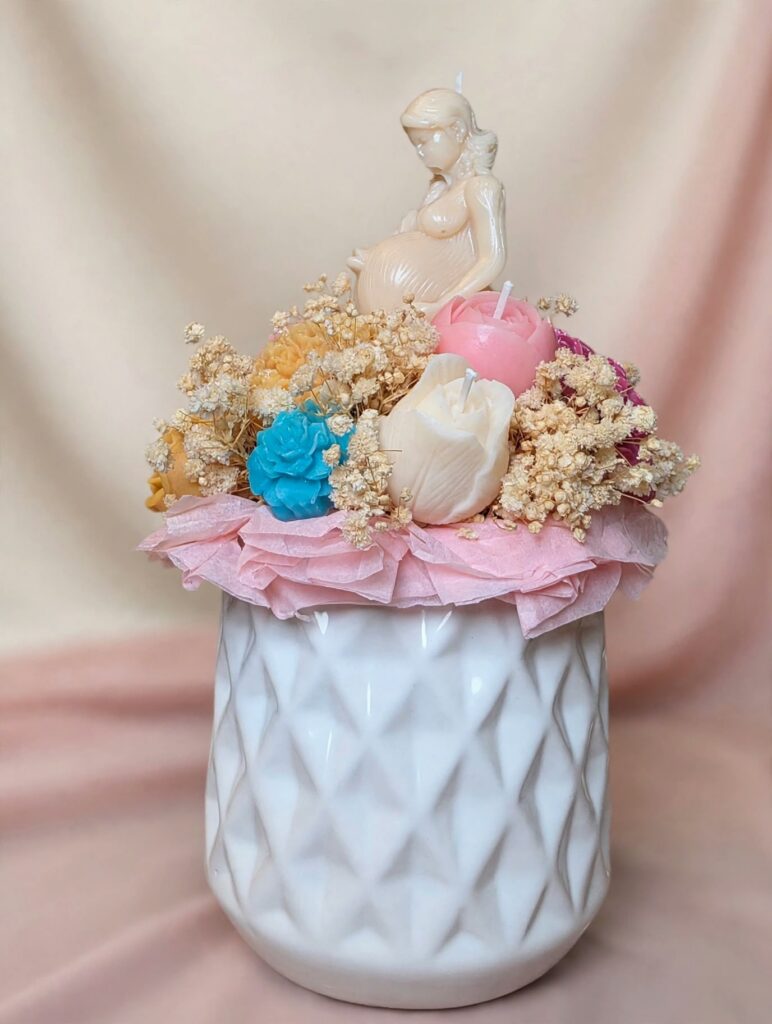 Candle bouquet in white diamond vase with pregnant figure and pink, blue and cream roses, Amaria Essence
